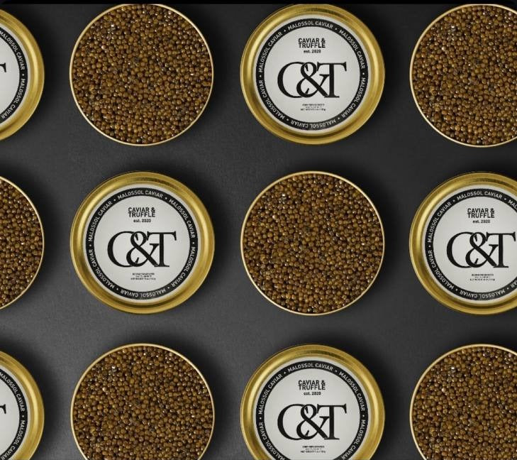 Grid of sealed Caviar and Truffle tins ready to go out